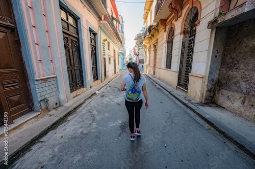 Woman tourist walking through the streets of Old Havana in Cuba. © Paulo