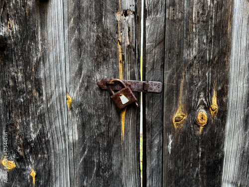 Capturing the nostalgia of an old wooden woor with an aged lock photo