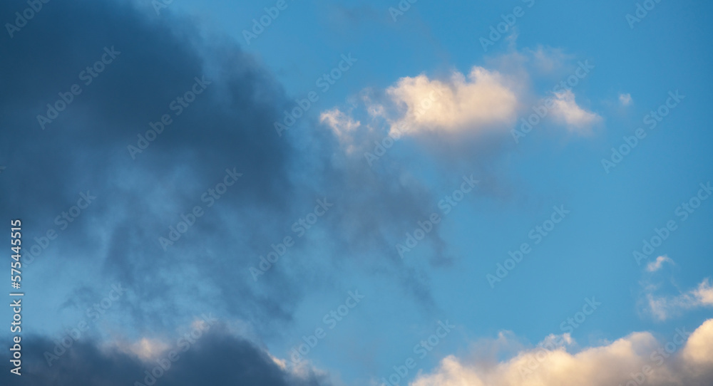 Beautiful  clouds on the  blue sunset sky. Sky clouds background.