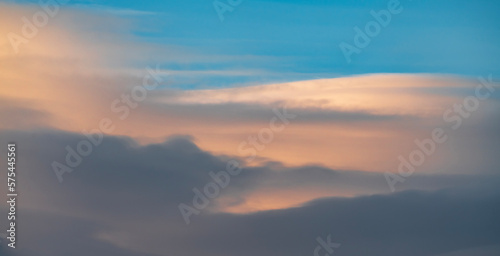 Beautiful clouds on the blue sunset sky. Sky clouds background.