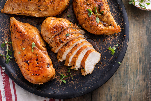 Canvas Print Grilled or roasted chicken breast on a serving plate