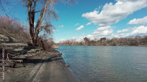 Pretty cloudy spring day on the levee shoreline of the sacramento river in nothern california  photo