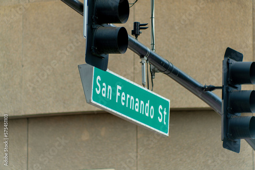 Sign on street light that say san fernando street in silicon valley san jose in downtown city with black traffic lights