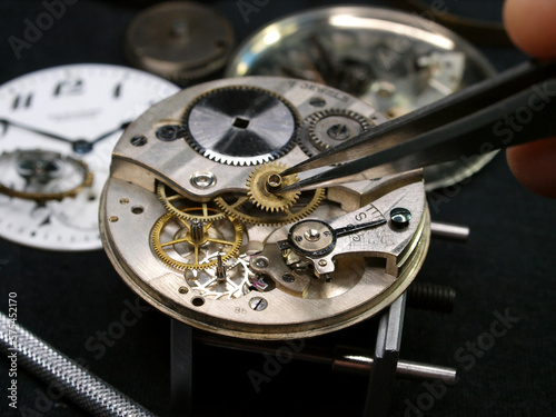 vintage watch mecahism under repair close up detail pic