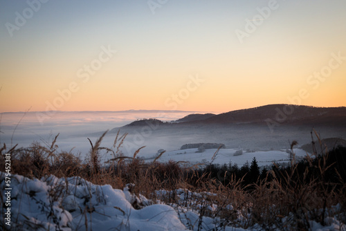 sunset over a foggy valley