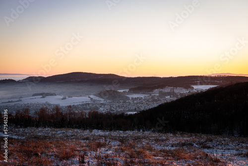 sunset over a foggy valley © Przemyslaw