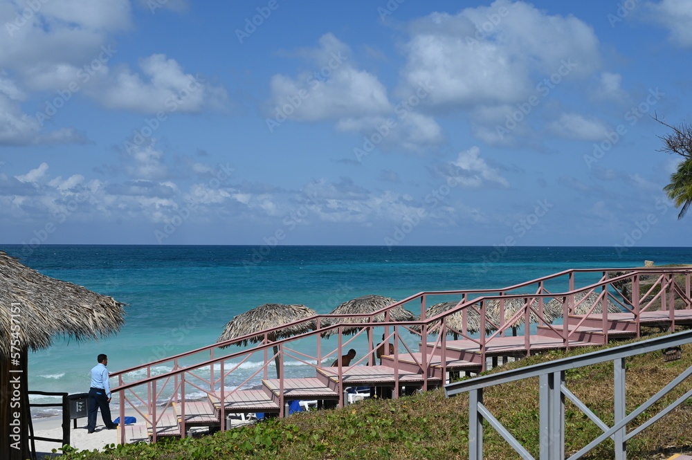 Varadero beach in Cuba in the year 2023. Blue sea, clear sky and many tourists on the beach. Varadero beach in Cuba in the year 2023. Blue sea, clear sky and many tourists on the beach.