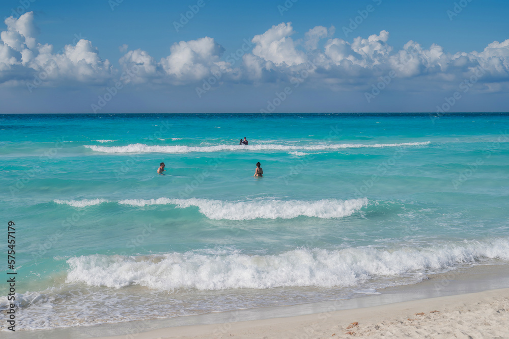 Varadero beach in Cuba in the year 2023. Blue sea, clear sky and many tourists on the beach.