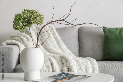 Vase with flowers, tree bra...