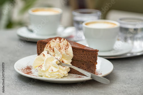 Slice of Sacher Torte cake on plate at Cafe in Vienna, Austria. © Mazur Travel