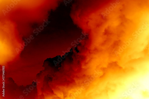 Abstract dramatic background in red and yellow colors. Color negative thunderclouds. Dramatic sky background. Panoramic image can be used as a web banner or wide site header.