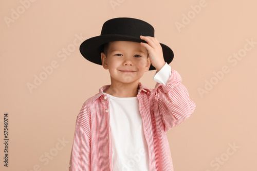 Cute little stylist in hat ...