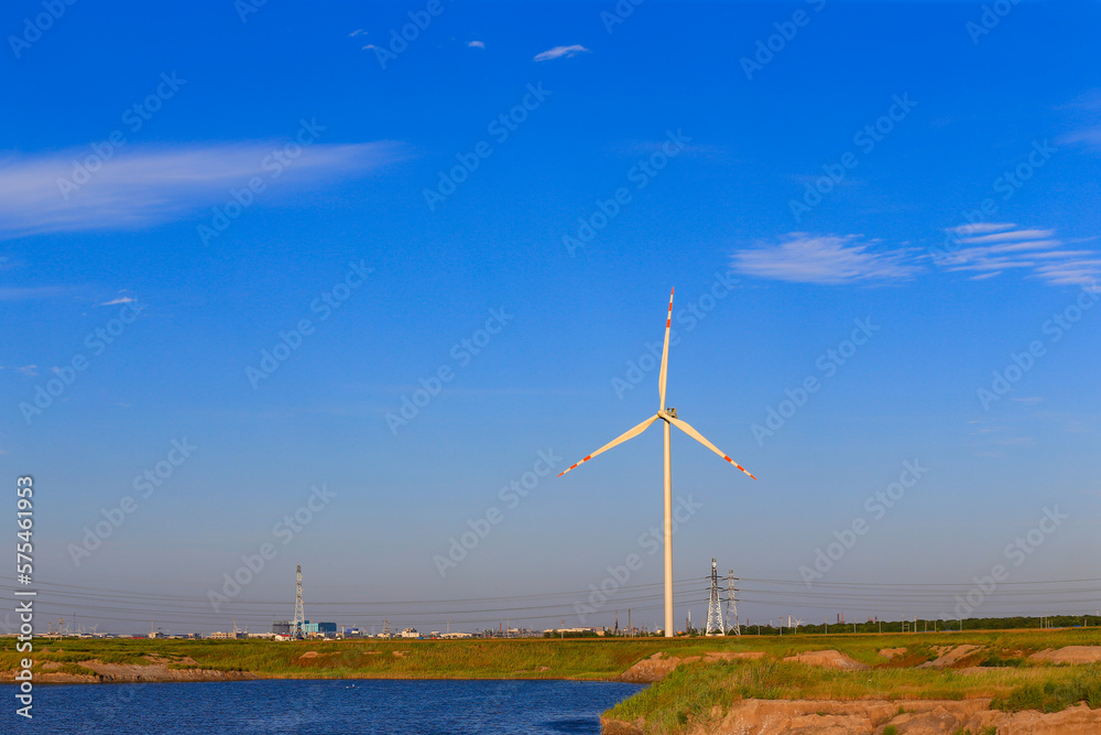 Windmill in the blue sky background Windmill in the blue sky background