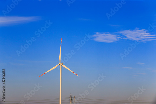 Windmill in the blue sky background