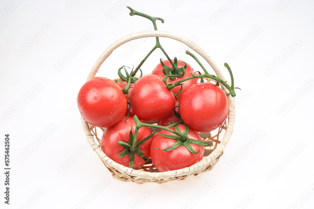 Tomatoes are in the basket, on the white background