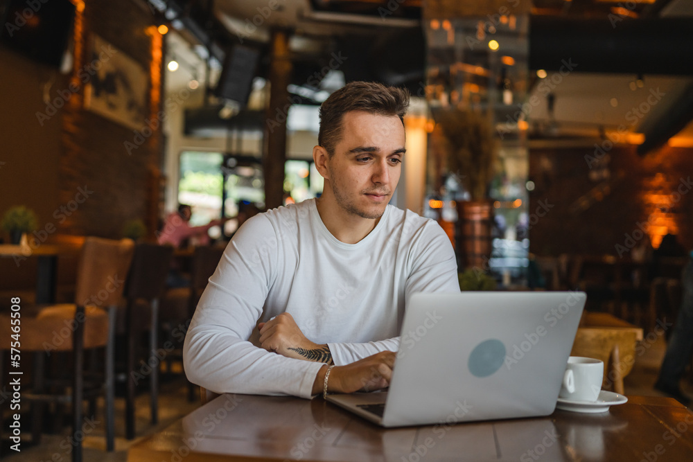 one man work on laptop computer at cafe with bad news worried one man work on laptop computer at cafe with bad news worried