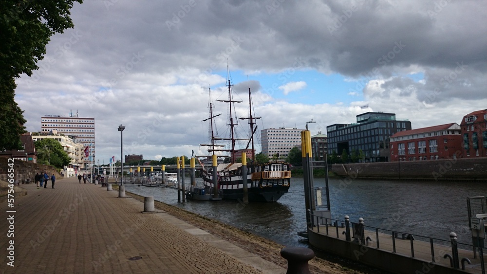 Ship, boat, pirate, sky, clouds, river, buildings at bremen, germany 