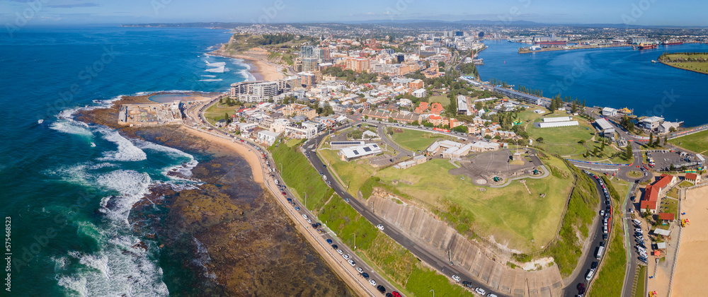Panoramic aerial drone view of the harbour city of Newcastle and Newcastle Harbour, NSW, Australia on a sunny day 