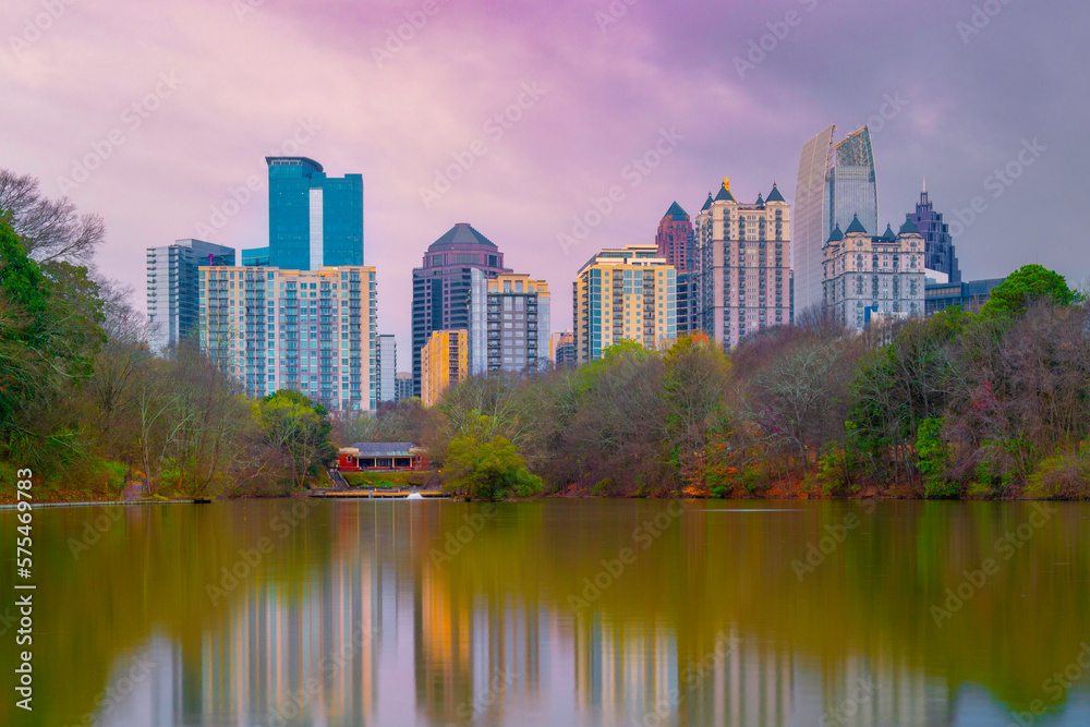 Atlanta City skyline, skyscrapers, buildings, forest, and water reflections over the Lake Clara Meer at Piedmont Park in the Capital of the U.S. State of Georgia, soft pastel colors