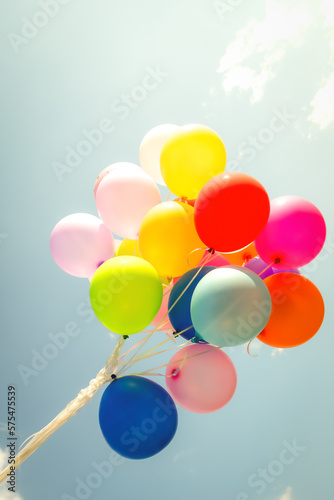 multi colored balloons done with a retro vintage  filter effect. concept of festival, celebration, birthday, for background design.