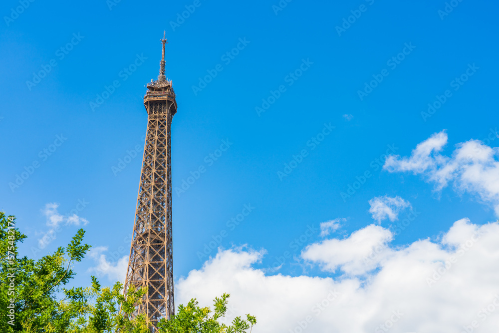 Obraz premium Top of Eiffel Tower seen from the park in Paris. France
