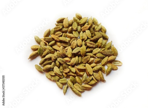 Closeup of dried cardamom isolated on white background.