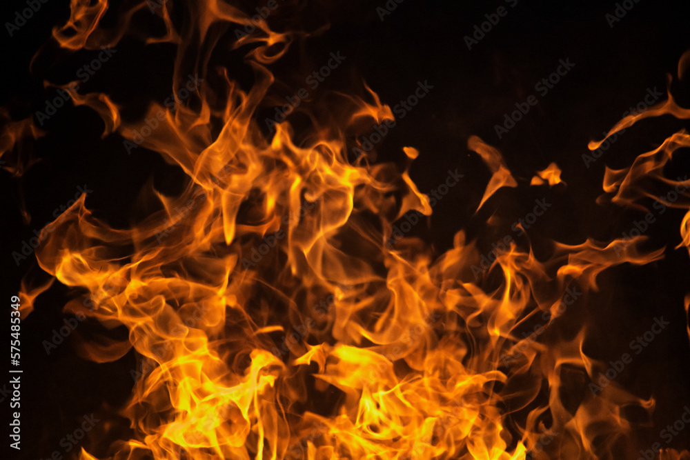 Close up burning flames on black background for graphic design or wallpaper Close up burning flames on black background for graphic design or wallpaper