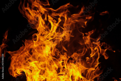 Close up burning flames on black background for graphic design or wallpaper