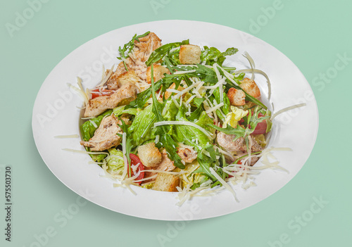 isolated tasty salad with chicken and arugula and mix vegetables, cheese for menu design