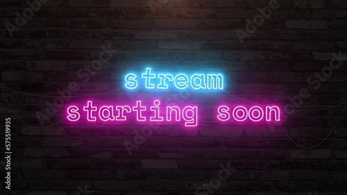 Stream starting soon with neon text effect in wall background. Seamless looping video photo