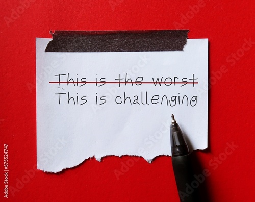 Картината върху платно Torn paper on red background with handwriting THIS IS THE WORST but crossed off