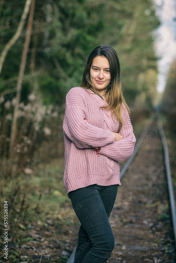 Portrait of a young beautiful dark-haired long-haired girl in the forest. Portrait of a young beautiful dark-haired long-haired girl in the forest.