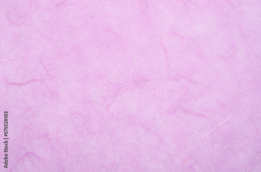 The texture of purple mulberry paper, for use as a background.