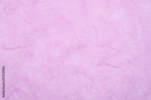 The texture of purple mulberry paper, for use as a background.