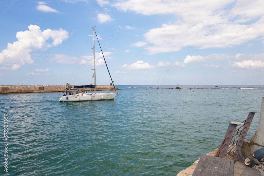Private yacht leaves the port in the old city of Yafo, in Tel Aviv - Yafo city, Israel