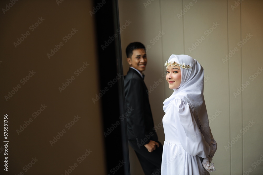 romantic prewedding photo couple of asian man and asian girls wearing neat suits black suits and white dresses indoor concept romantic prewedding photo couple of asian man and asian girls wearing neat suits black suits and white dresses indoor concept