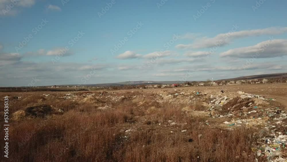 Garbage polluted and dirty field. Aerial view. Garbage polluted and dirty field. Aerial view.