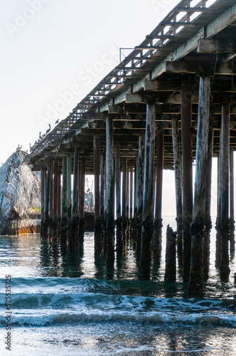 Exterior shot of the wooden support structure that carries the Sea Cliff Pier near Aptos, California. © Goldilock Project