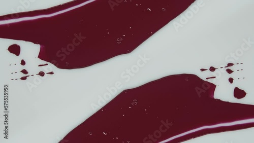 Magento. Red lipstick. Ink on white background. Smudge paint. Decorative cosmetics. Screensaver. Сreate abstract art. Watercolor, acrylic, oil, and pastel. Product related to makeup and cosmetics