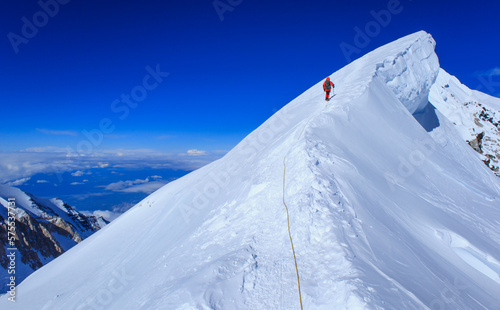 A climber reaching the summit of Mt Denali in Alaska, the highest peak in North America photo