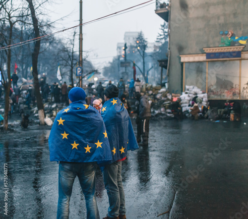 Revolution of Dignity in Ukraine. Two men wearing EU flags during Maidan revolution in 2014 photo