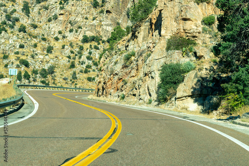 Obraz na plátne Hot summer road in hills and mountains of arizona for vehicle and car transporta