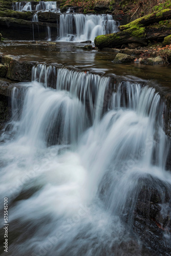 Beautiful claming landscape image of Scaleber Force waterfall in Yorkshire Dales in England during Winter morning