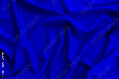 Bright thin knitted fabric with drapery, top view. 