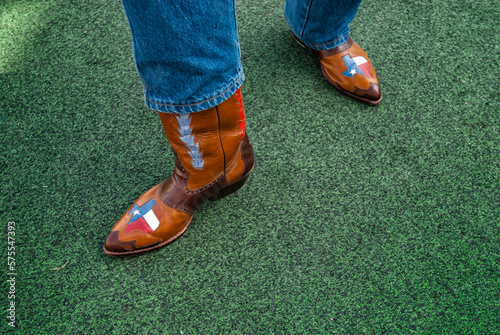 A Texan displays his pride of the lone star state with his custom cowboy boots. photo