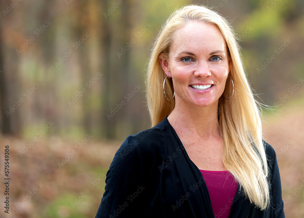 40 year tall blond woman outdoors in casual clothing. 40 year tall blond woman outdoors in casual clothing.