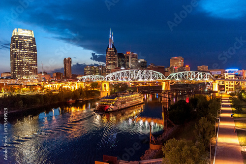 Twilight view of Nashville skyline with Cumberland River and General Jackson Showboat on water, Nashville, Tennessee, USA