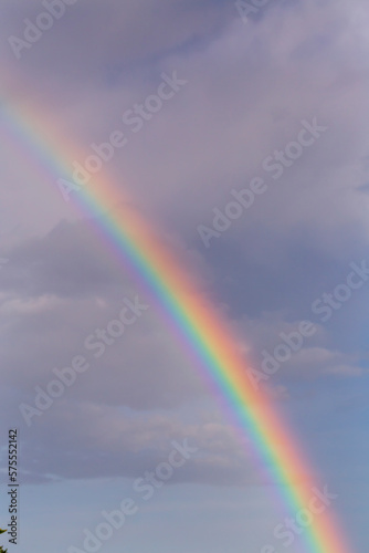 View of a rainbow in front of the clouds