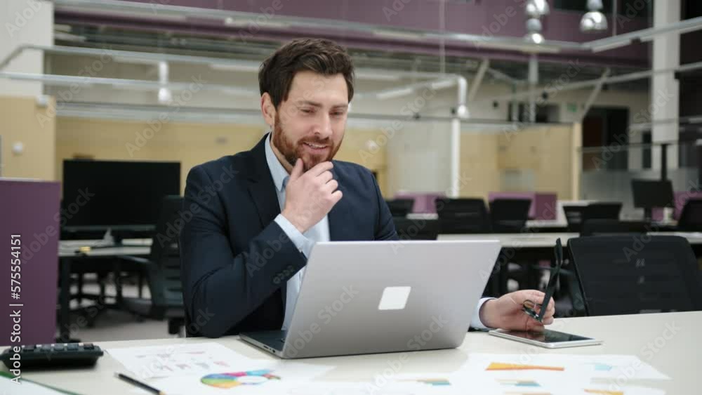 Portrait of caucasian entrepreneur in glasses and formal suit browsing internet. Close-up shot of successful businessman looking happy. High quality 4k footage Portrait of caucasian entrepreneur in glasses and formal suit browsing internet. Close-up shot of successful businessman looking happy. High quality 4k footage