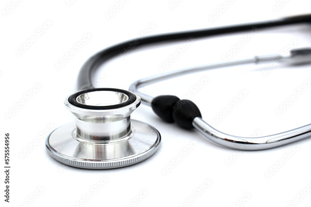 On a white isolated background lies a black stethoscope. On a white isolated background lies a black stethoscope.